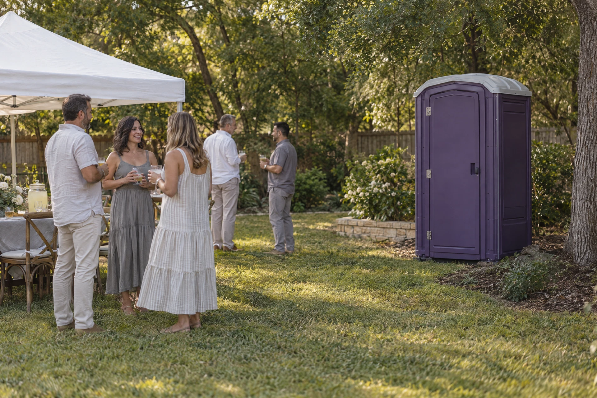 Portable restroom at a backyard gathering